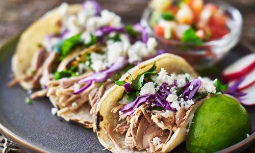 bigstock-Street-tacos--with-carnitas--225381346